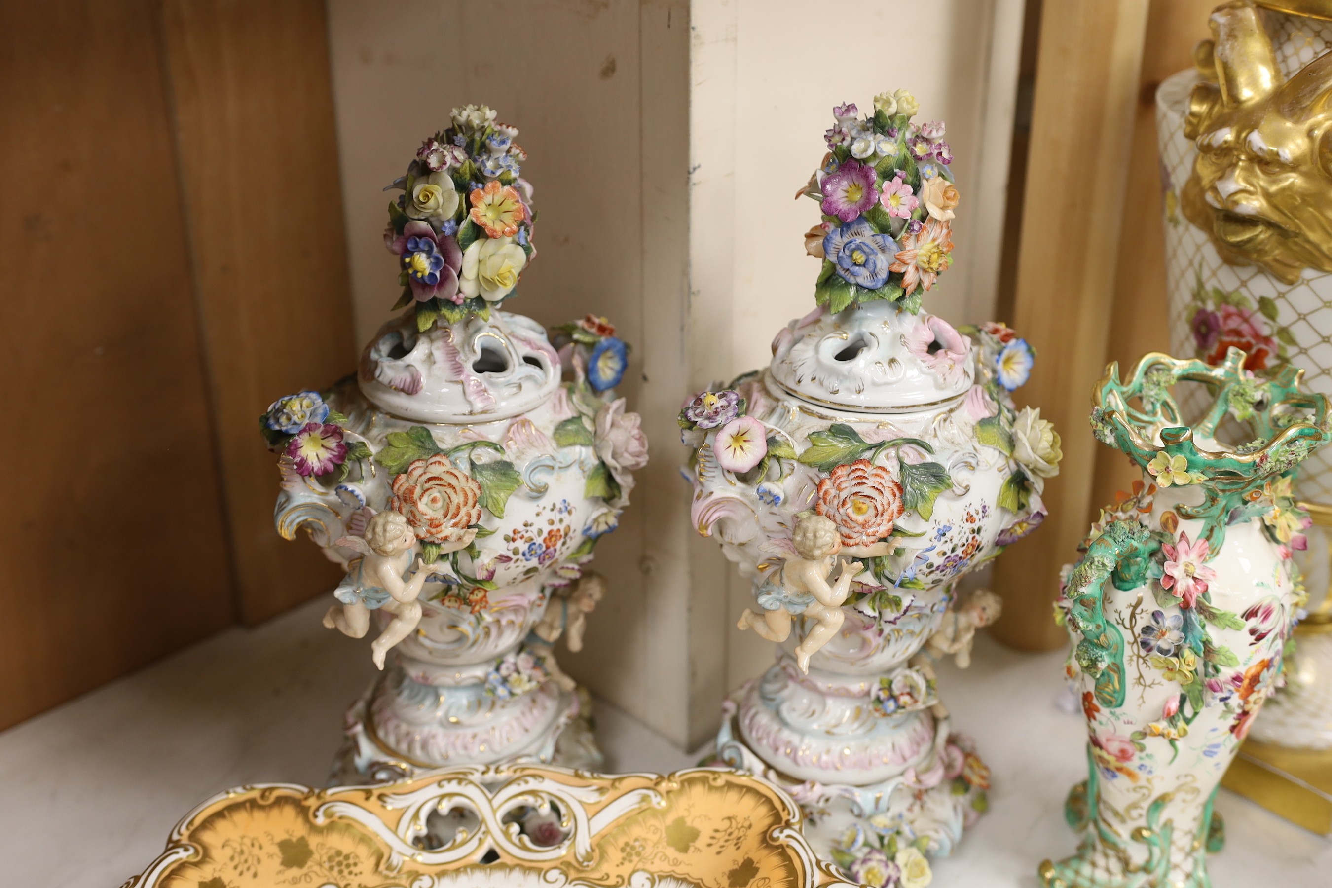 A mixed collection of floral encrusted 19th century and later Continental porcelain